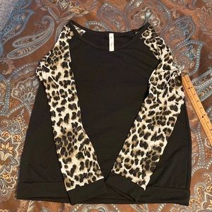 Super cute Long Sleeved top with leopard print semi sheer sleeves banded waist.